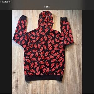 Nike Black Hoodie with Red Logo Pattern